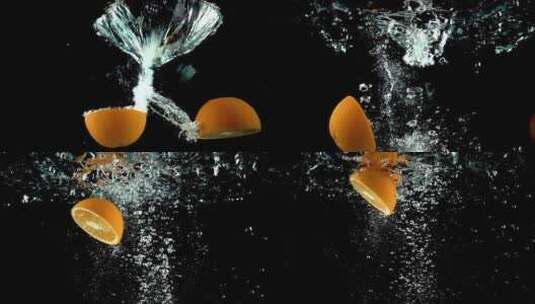 切开的橙子落水的慢镜头高清在线视频素材下载