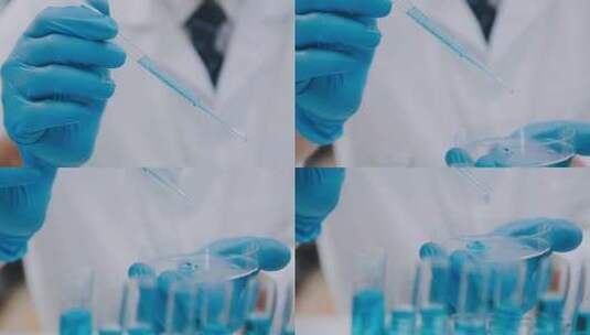 研究员在实验室将蓝色液体滴入试管高清在线视频素材下载