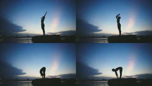 清晨海边岩石上做瑜伽的女人剪影高清在线视频素材下载