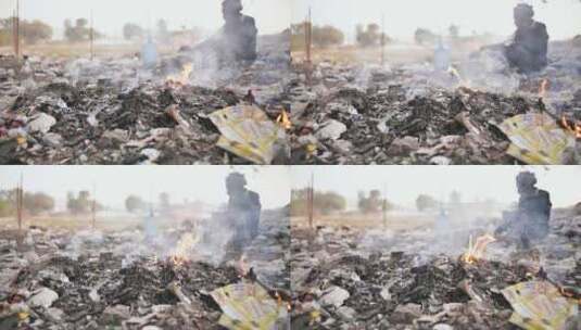 燃烧的垃圾和可怜的印度老人高清在线视频素材下载