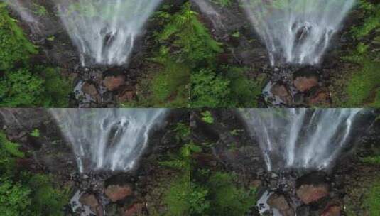 沿着热带雨林瀑布下降到下面的天然岩石池。高清在线视频素材下载