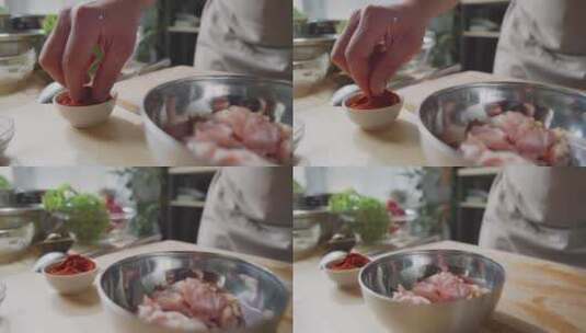 厨师把辣椒粉撒到鸡肉里高清在线视频素材下载
