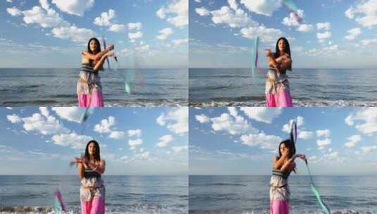 女人在海边舞动丝带高清在线视频素材下载