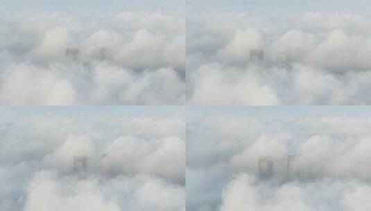云海下的金茂览秀城航拍高清在线视频素材下载