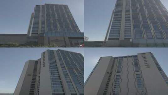 竖版航拍哈尔滨市松北香格里拉大酒店高清在线视频素材下载