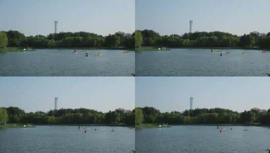 湖里的皮划艇远处的中国樽高清在线视频素材下载