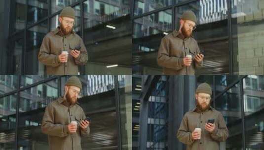 男人端着咖啡玩手机高清在线视频素材下载
