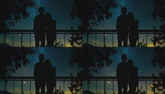 夫妻在大窗户前俯瞰星空高清在线视频素材下载