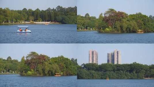 公园游船在湖面上行驶，游湖4k视频素材高清在线视频素材下载