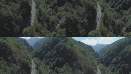 大山中的公路上骑行高清在线视频素材下载