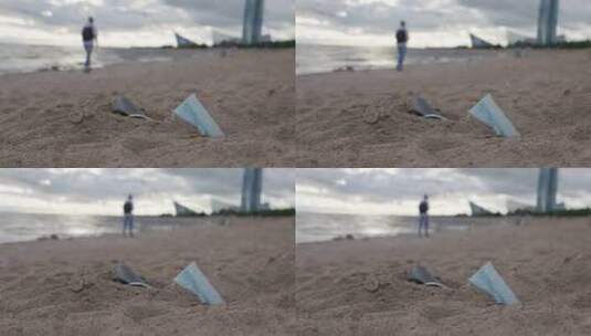 海滩上的垃圾人们在肮脏的海滩上散步高清在线视频素材下载