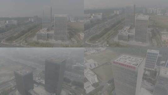 武汉雾气缭绕公路对面的白色建筑航拍高清在线视频素材下载