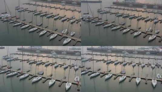青岛航拍夕阳落日码头帆船高清在线视频素材下载