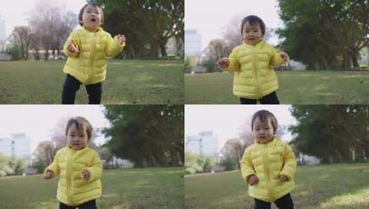 初学走路的可爱小女孩在公园里快乐玩耍高清在线视频素材下载