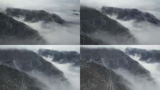 堆满积雪的山峰云海壮丽自然风光航拍视频高清在线视频素材下载