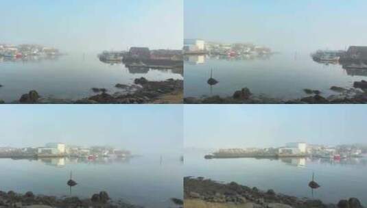 一个小岛上的渔村，笼罩在海雾中，沐浴在春高清在线视频素材下载