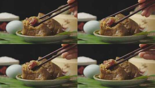 筷子夹起的大肉粽端午节吃粽子高清在线视频素材下载