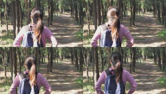 亚洲中国人女人树林旅游漫步拍照对话看风景高清在线视频素材下载