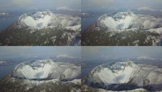 日本北海道冬季摩周湖和摩周岳火山口航拍高清在线视频素材下载