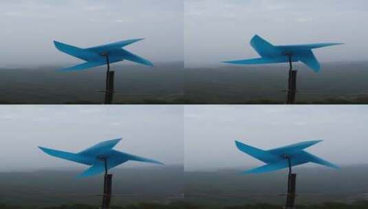 在风中转动的蓝色风车高清在线视频素材下载