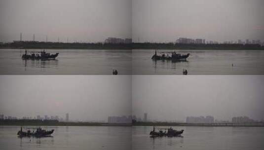 阴天傍晚长江上的渔船捕鱼船只行驶高清在线视频素材下载