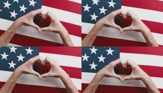 在美国国旗上双手比心高清在线视频素材下载