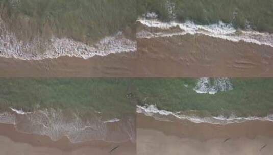 海浪冲击沙滩，俯瞰的视角高清在线视频素材下载