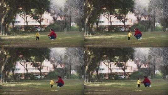 小朋友和妈妈在春天的公园里玩耍学步高清在线视频素材下载