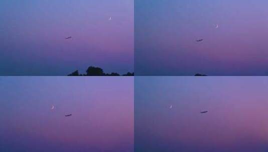 飞机飞过傍晚的月空一轮弯月高清在线视频素材下载
