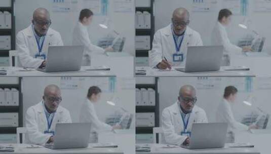 黑人医生在医院的笔记本电脑上工作高清在线视频素材下载