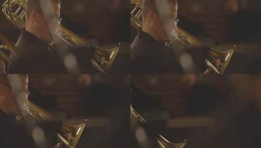 长号手在昏暗的管弦乐队中演奏乐器高清在线视频素材下载