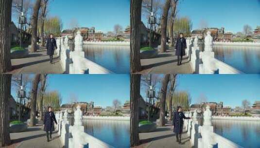冬季走在北京什刹海湖边的亚洲女性高清在线视频素材下载