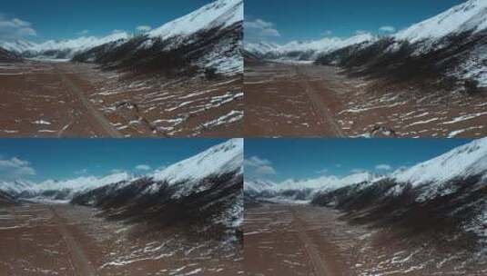 雪山峡谷视频青藏高原延绵的雪山公路和盆地高清在线视频素材下载