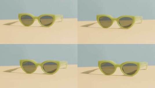黄蓝背景下太阳镜的暑假概念高清在线视频素材下载