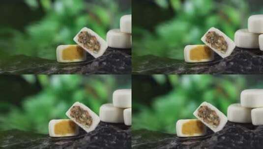 户外石头上中秋节港式五仁蛋黄月饼移轴高清在线视频素材下载