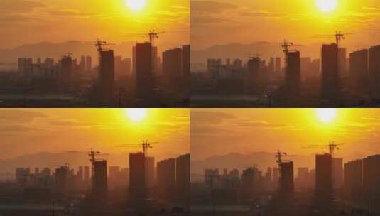 夕阳下建设开发中的城市建筑工地塔吊剪影高清在线视频素材下载