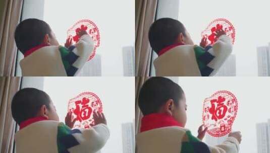 中国母子春节贴窗花高清在线视频素材下载