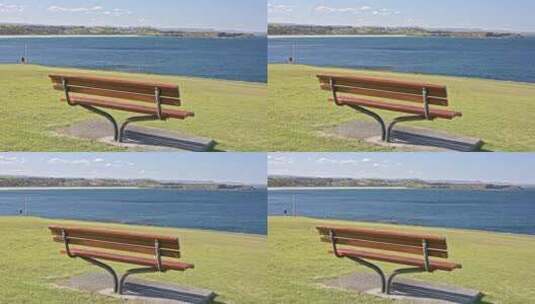 澳大利亚卧龙岗唯美海湾灯塔小路长椅草坪高清在线视频素材下载