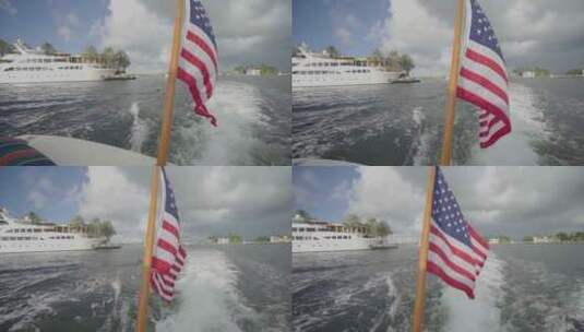 高速行驶的摩托艇上的国旗高清在线视频素材下载