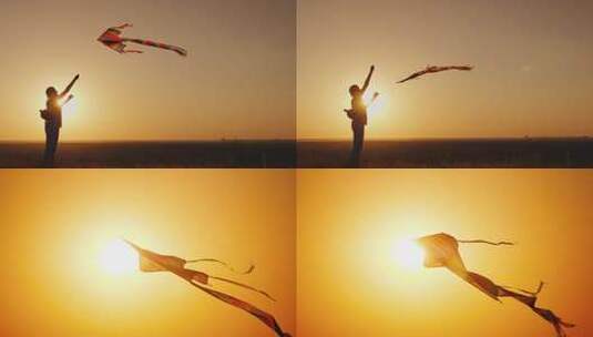 夕阳日落时放风筝剪影高清在线视频素材下载