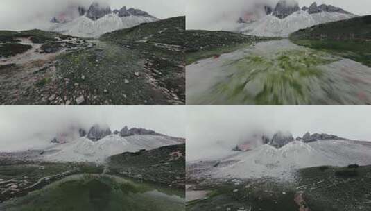 积雪的三座山峰和融水潭高清在线视频素材下载