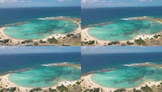 阿鲁巴岛惊人的婴儿海滩和阿鲁巴岛的海岸加勒比白色海滩与蓝色海洋热带海滩高清在线视频素材下载