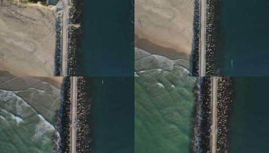 最近建造的混凝土人行道，将划船通道和受欢迎的冲浪海滩分开。高d高清在线视频素材下载