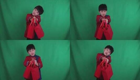 中国小男孩恭贺新年拜年送礼慢镜绿幕抠像高清在线视频素材下载