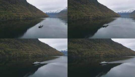 秋天的色彩拥抱着盖兰杰峡湾，渡船穿过冰雪高清在线视频素材下载