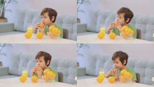 认真品尝橙子一个孩子对水果的关注反映了一高清在线视频素材下载