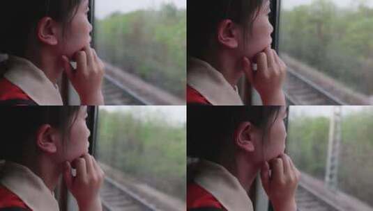 归家途中望向火车窗外的女人高清在线视频素材下载