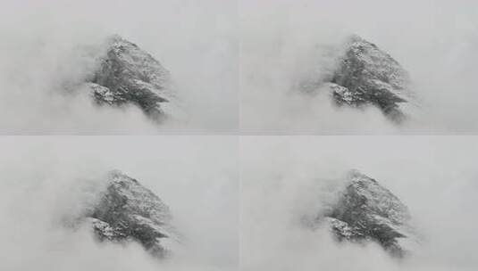 云中最小的雪白岩石面，极简主义崎岖的落基高清在线视频素材下载