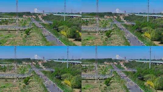 公路骑行人群与桥梁景观高清在线视频素材下载