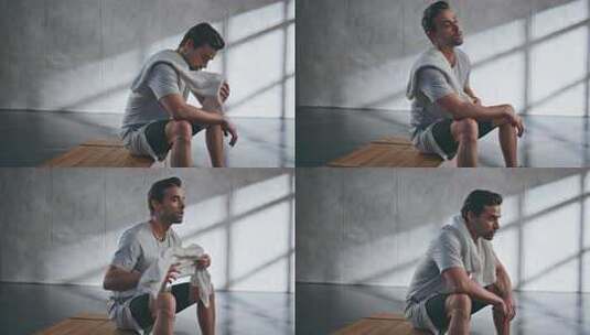 汗流浃背的运动员在疲劳的举重运动员休息时高清在线视频素材下载